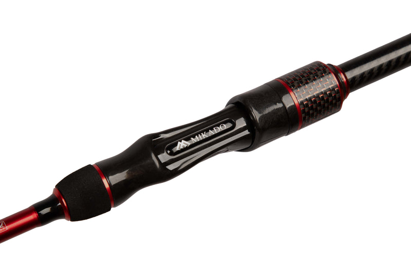 Load image into Gallery viewer, Close-up of the Mikado MFT Elite 240cm Spinning Rod handle and reel seat with black grip, carbon fiber texture, and red accents.