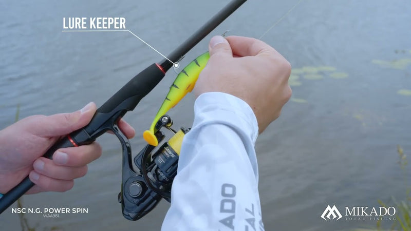 Load image into Gallery viewer, Mikado NSC NG Power Spin 245cm Rod showing a lure keeper holding a fishing lure, with a Jaws reel.