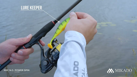 Mikado NSC NG Power Spin 245cm Rod showing a lure keeper holding a fishing lure, with a Jaws reel.